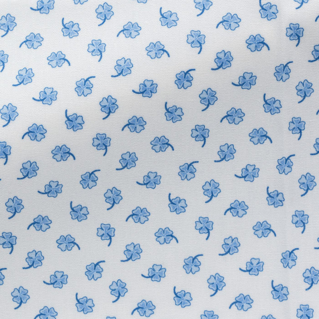 White-Cotton-Poplin-With-Light-Blue-Four-Leaf-CloversPC07160gr Fabric